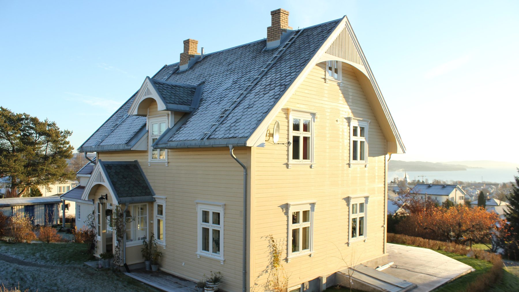 A timber house with a wide sheltering roof.